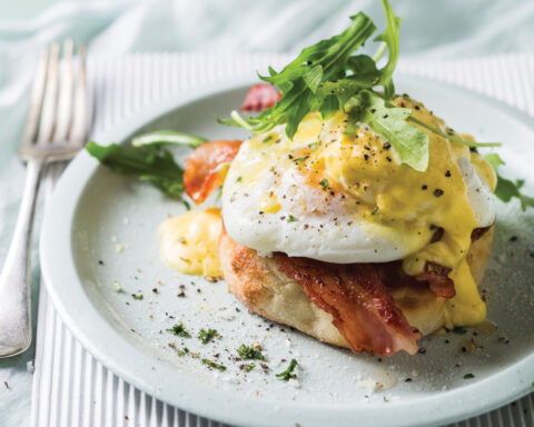 Prepared Eggs Benedict dish on the table.