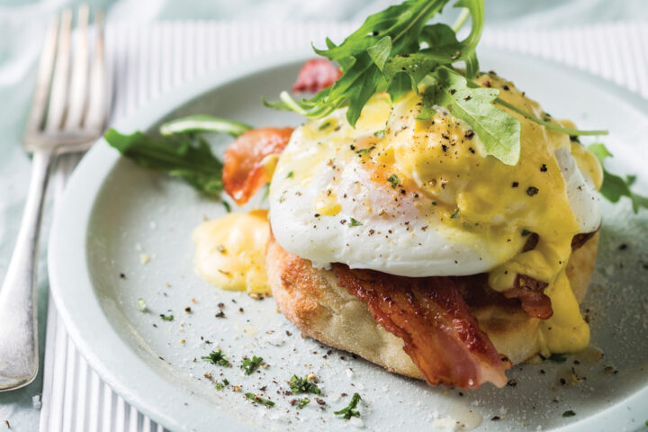 Prepared Eggs Benedict dish on the table.