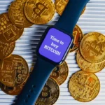 Apple Watch and golden coins with Bitcoin symbol