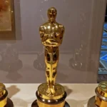 Three Oscar statuettes