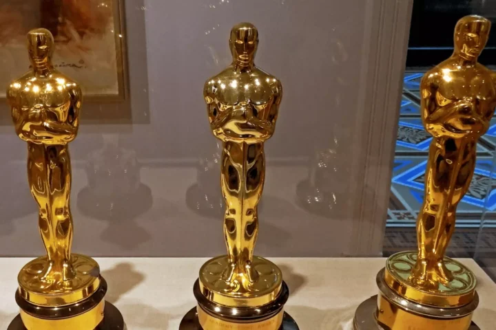 Three Oscar statuettes