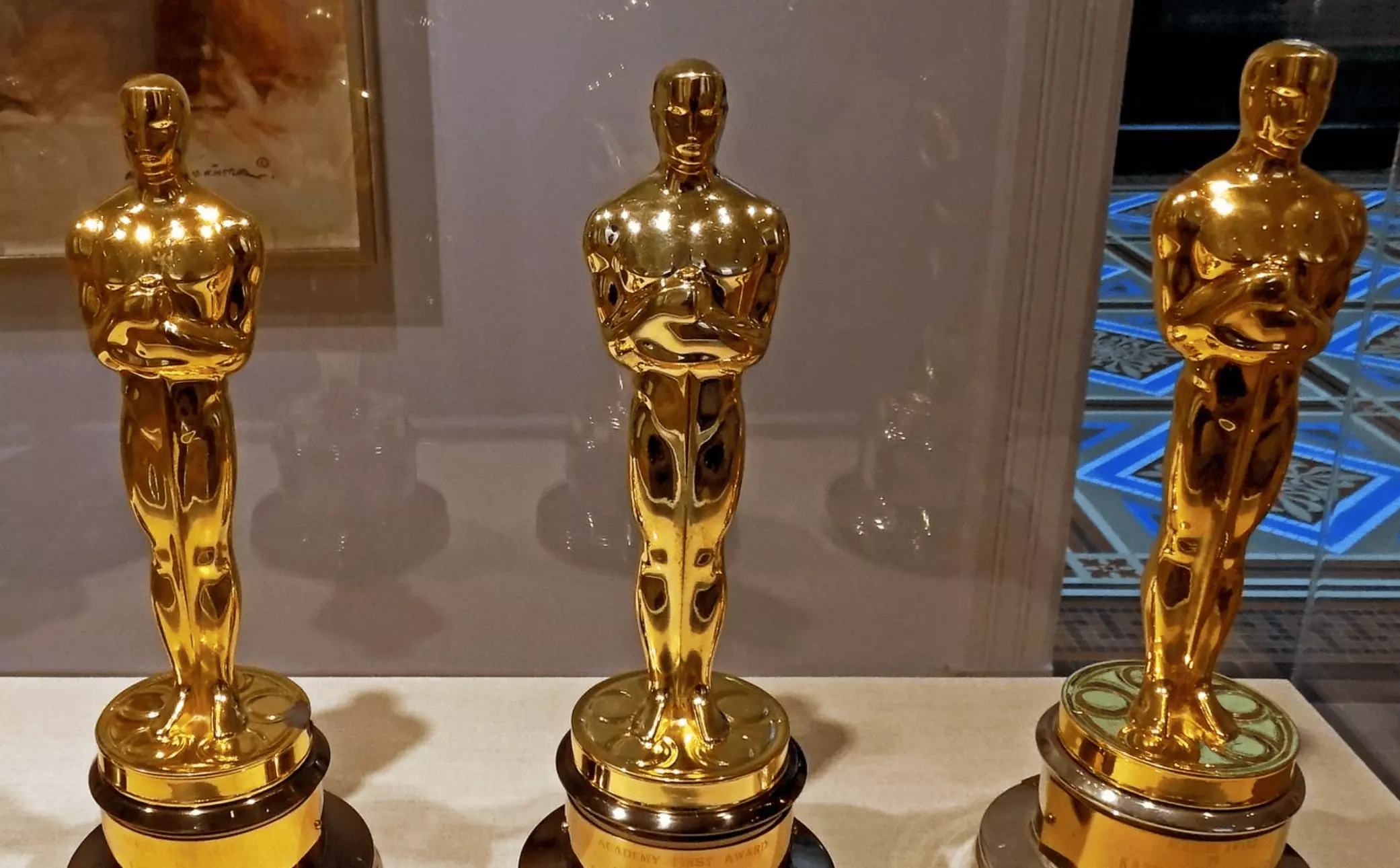 Three Oscar statuettes