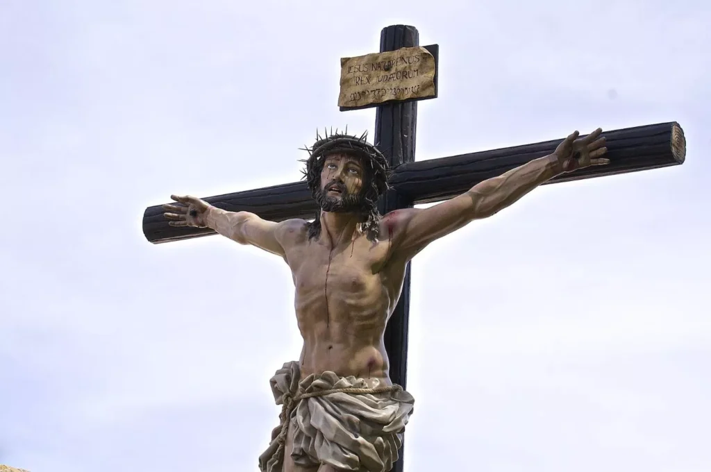 Crucified Jesus Christ with a crown of thorns on his head.