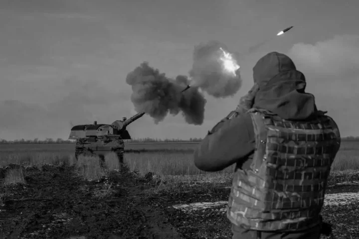 Ukrainian servicemen fire a German howitzer